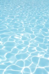 Fototapeta premium Light reflecting on calm blue water surface.