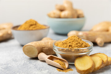 Fresh ginger on wooden background. Dry ginger. Sliced ​​ginger with honey and lemon. Ginger...