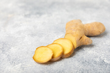 Fresh ginger on wooden background. Dry ginger. Sliced ​​ginger with honey and lemon. Ginger...