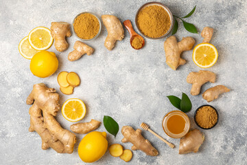 Fresh ginger on wooden background. Dry ginger. Sliced ​​ginger with honey and lemon. Ginger...
