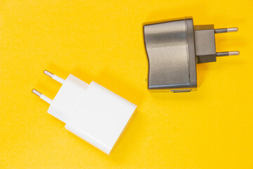 White and Black charger for USB cable, this is accesories for phone, laptops or another electronical devices.
