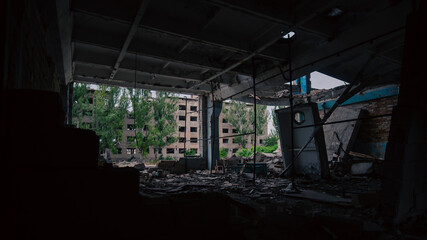 Fototapeta premium destroyed and burned houses in the city in Ukraine