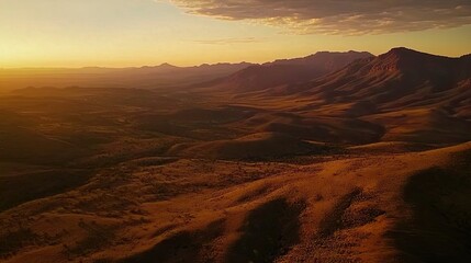 Naklejka premium Sunset over desert mountains, aerial view, golden hour landscape, travel background