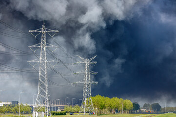 Thick smoke rises above industrial area following a fire at a manufacturing facility in the early...