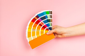 Color palette on a bright colored background. Color palette guide. paper catalog of rainbow color. creative.Palette, samples of trending colors. Color swatches. Decor and interior designer. Top view. 