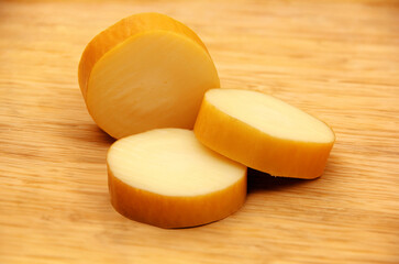 CHOPPED PROVOLONE ON WOODEN TABLE