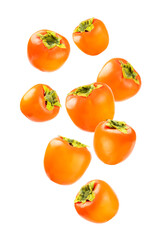 Persimmon isolated on white background. Persimmon fruit. Slice of ripe, juicy, sweet persimmon fruit. Vegan. Fruit garden. Close-up.