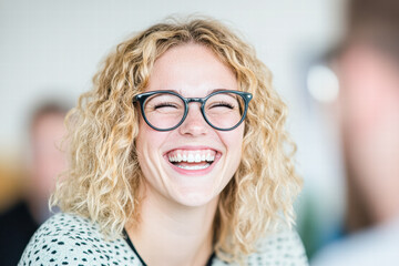 Obraz premium Cheerful woman laughing in a bright outdoor setting modern portrait close-up happiness