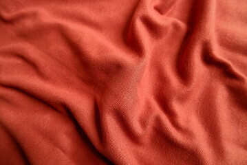 Terracotta color interlock knit fabric texture seamless with beautiful closeup detail fabric. Luxury interlock knit textile pattern with soft and delicate material.