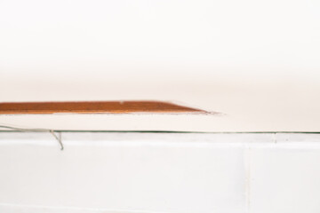Fototapeta premium Close-up of Wooden Edge on White Surface