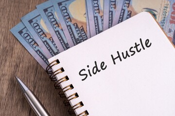 Side hustle text on note pad 