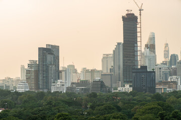Obraz premium Downtown city office building with car transport park PM 2.5 smoke air pollution