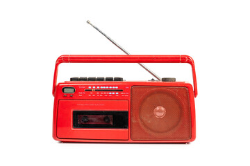 Old fashioned red cassette radio with antenna isolated on white background with clipping path