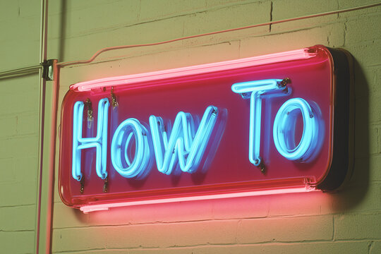 Neon How To Sign: A vibrant pink and blue neon sign displaying "How To" against a textured brick wall.  The image is a statement of guidance, instruction, and problem-solving.