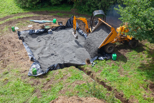 Installing a sand and gravel filter bed for a domestic septic tank using  a front end loader  and digger, sewage, sanitation, purification