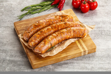 Raw sausages with spices and herbs