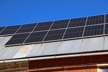Rural home retrofitted with photovoltaic panels in Poland