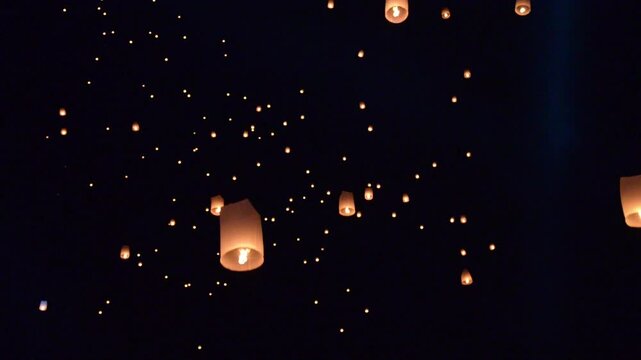 Floating lanterns or hot-air balloons during Loy Krathong Festival in Chiang Mai Thailand - activity of local favorite tourist festival of Northern Thailand region concept