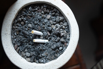 Cigarette Butts in Ash and Gravel Pot