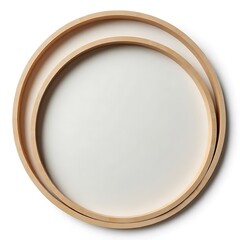 Obraz premium Nested Round Wooden Trays: Two circular wooden trays, one nestled inside the other, create a visually appealing and minimalist design. The light wood tone adds a touch of warmth and sophistication. 