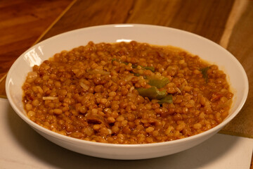 Lentils plate point of view. Spanish classic meal preparation