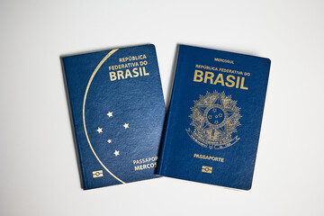 Two Brazilian passports in different design on white background