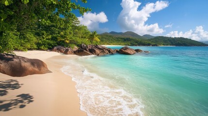 Fototapeta premium Secluded Tropical Beach with Turquoise Water and Green Hills under a Blue Sky