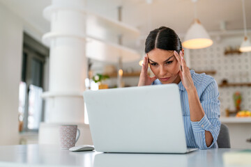 Frustrated businesswoman at office desk, feeling tired after unproductive work, creative crisis
