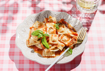 ravioli in tomato sauce with basil