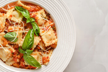 ravioli in tomato sauce with basil