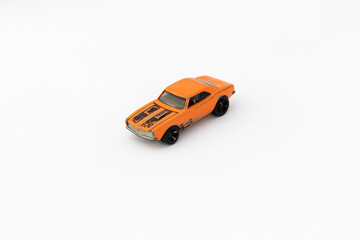 Miniature Orange Toy Car on White isolated Background