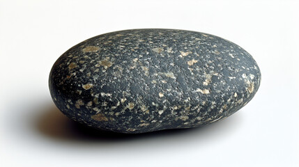Smooth, dark gray stone with tiny light spots, lying on a clean white surface