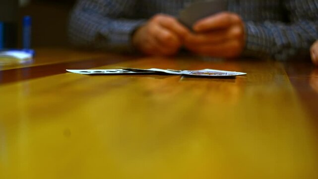 Cinematic close-up stock videos that bring the world of card games to life.  Expertly shot with attention to detail, these clips feature dramatic lighting and smooth camera movements.