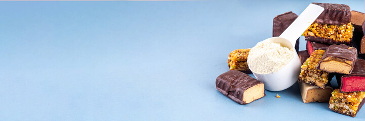 Set of various energy protein bar. Different taste of protein bars and snacks, with protein protein whey powder scoop