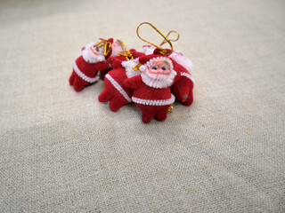 Small sculpture of Santa Claus on white background.