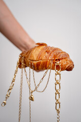 This is a Unique Croissant Handbag designed with elegant Gold Chains for a chic look