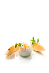 sweet homemade yogurt in a jar with pieces of ripe melon