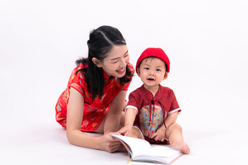 Naklejka premium Portrait of mother and son in Chinese New Year celebration clothes