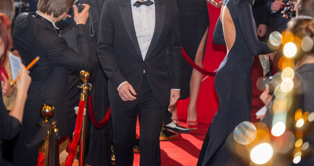 Blurred abstract background with red carpet and celebrities