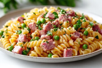 Pasta dish with ham and peas, perfect for lunch or dinner