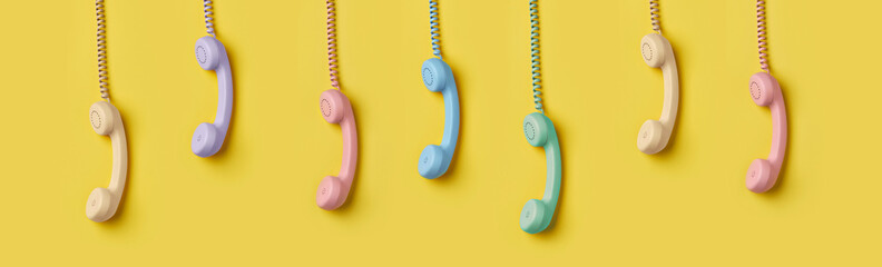 Creative layout with retro phone handsets pastel colors on yellow background.
