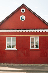 one-story house painted in burgundy color