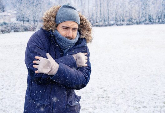 One man sensitive to cold freezing outdoor in the snow