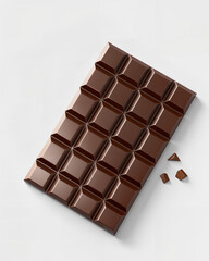 Obraz premium Chocolate bar with broken pieces on a light background, perfect for sweet tooth cravings and dessert preparations