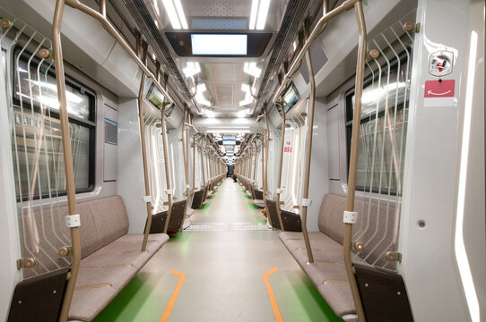Interior of the modern subway carriage with empty seats
