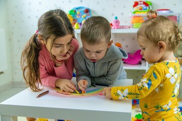 Fototapeta premium Children playing with toys in the room. Selective focus