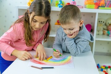 Children playing with toys in the room. Selective focus