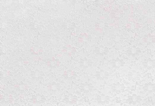 Closeup of White lace with flowers on white background