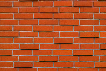 Red brick wall. Brick wall texture. Horizontal background for text or layout about construction. Interior or exterior background design.