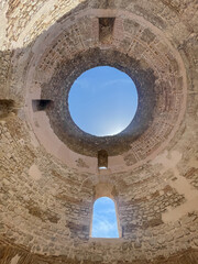 Split, Croatia - July 1, 2024: Historic downtown. Looking straigth up from under the open dome of Vestibule historic building in Diocletian Palace